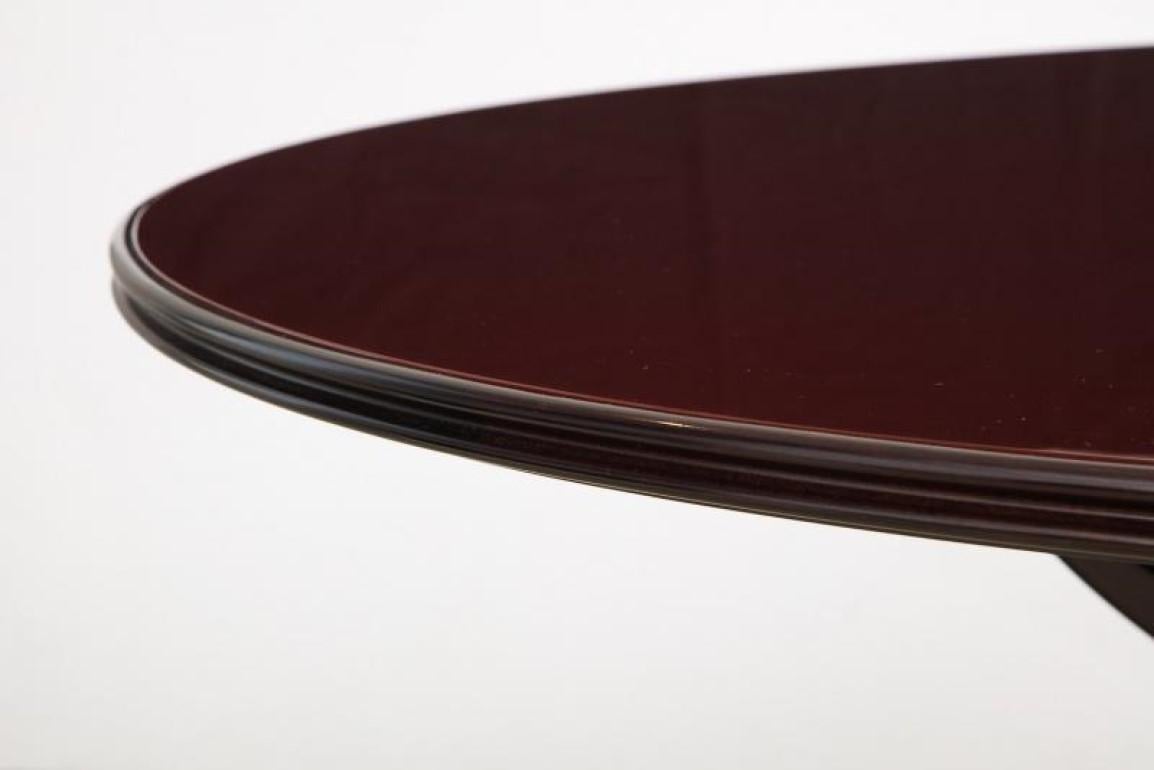 Circular Dining Table by Osvaldo Borsani for ABV & Tecno.  Dark stained walnut and back-painted glass. This model is quite unusual in that it was originally designed for sale through ABV, model #7387, and starting in 1953 was also available from