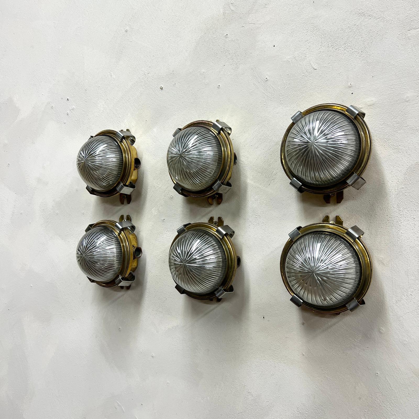 20th Century Circular Domed Holophane and Pressed Brass Wall lights