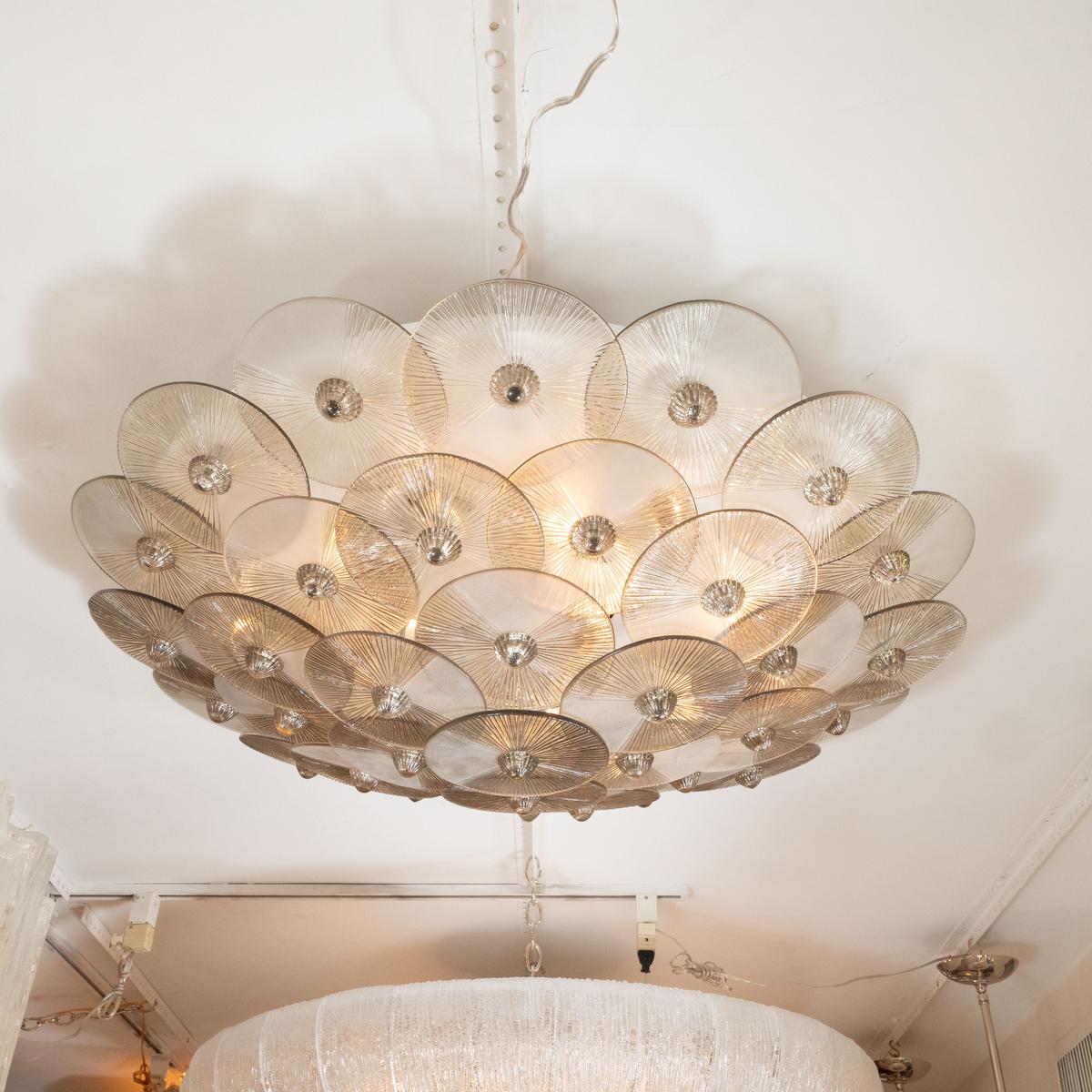 Circular flush mount ceiling fixture composed of smoked glass textured disk shades.