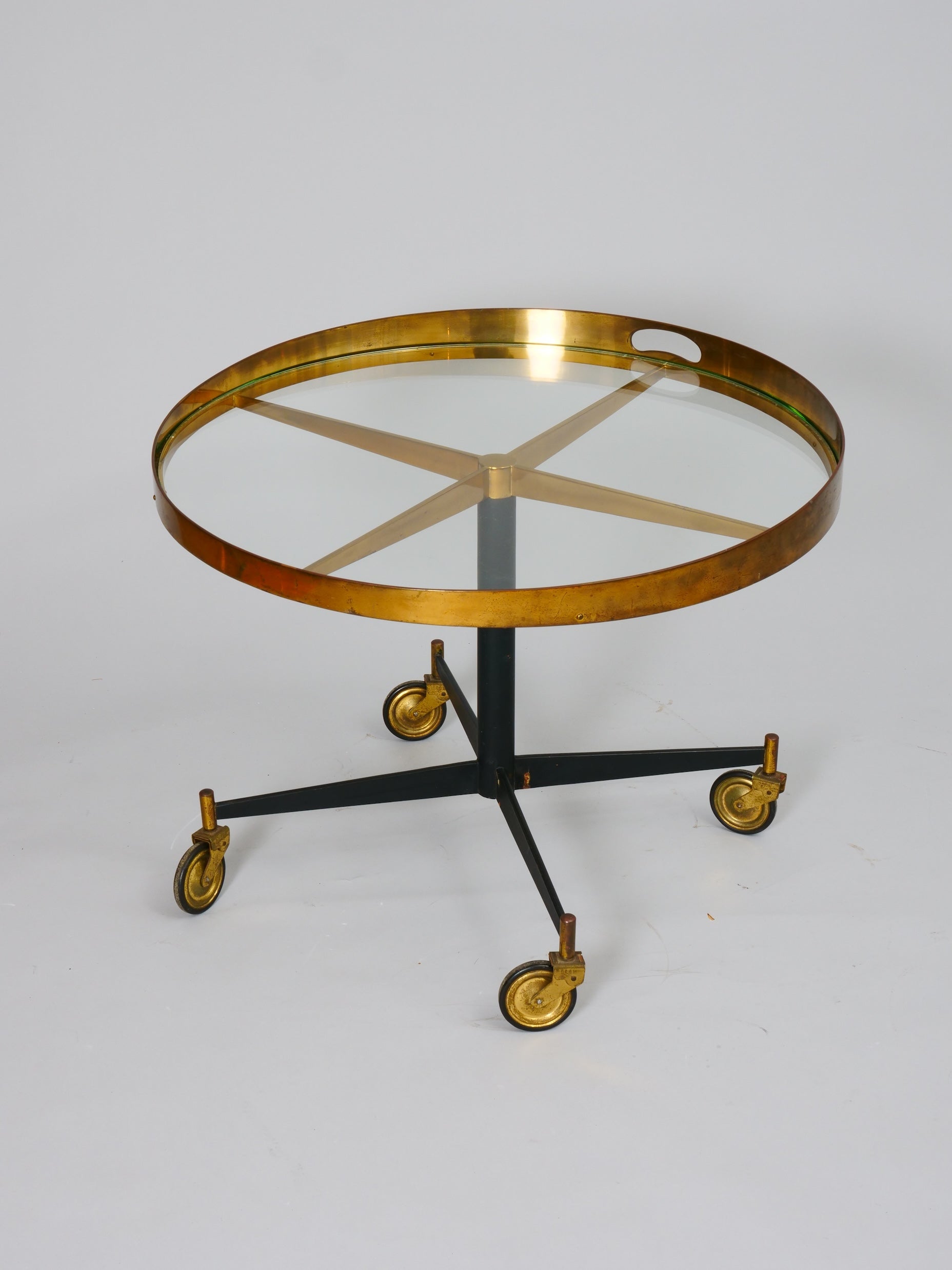 Lovely circular brass table on casters. 

Italy c1950. Lovely patina to brass. 

