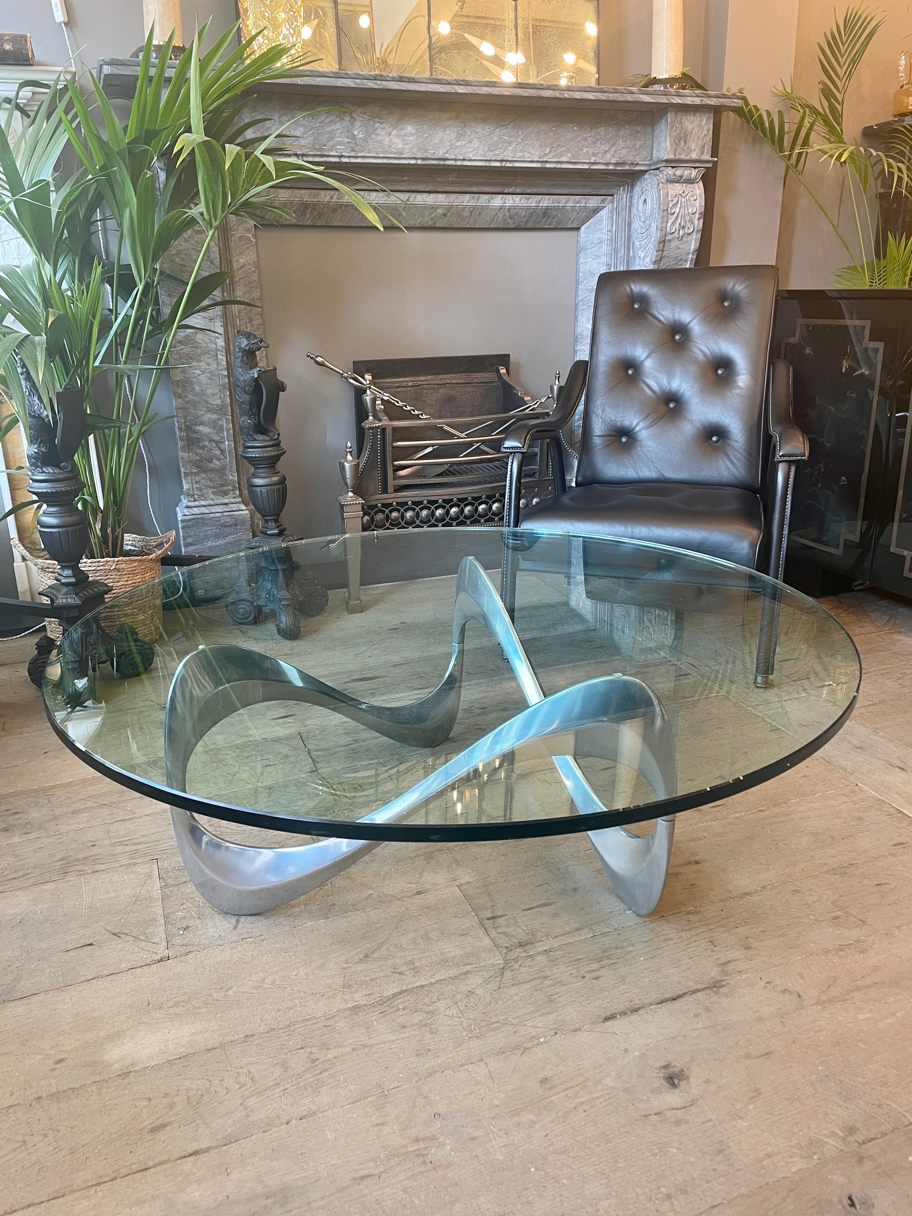 Iconic ’Snake’ coffee table designed in 1965 by Knut Hesterberg for Ronald Schmitt Organic shaped aluminium base supports heavy round shaped original glass top Table. In good condition both original glass top and base.
