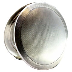 Circular guilloche silver toiletry box with hinged lid