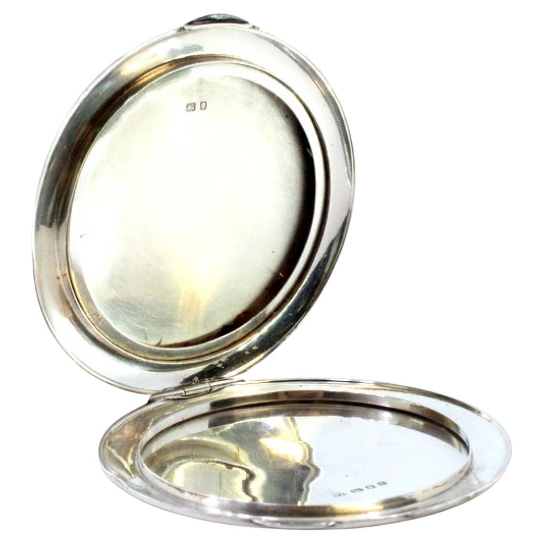 Circular guilloche silver toiletry box with hinged lid