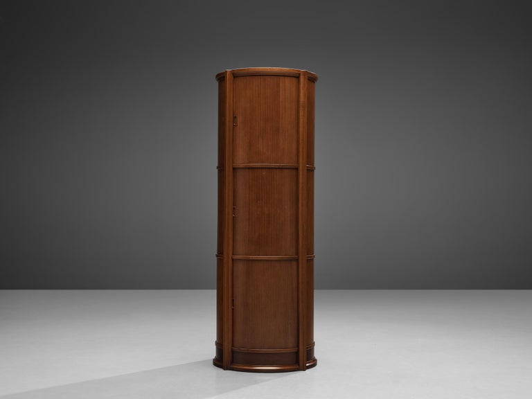 Circular cabinet, walnut, metal, Italy, 1950s

Free-standing cabinet or bookcase in circular shape. Three levels with shelves allow you to showcase your chosen belongings. Each level is equipped with sliding doors that can close up the cabinet.