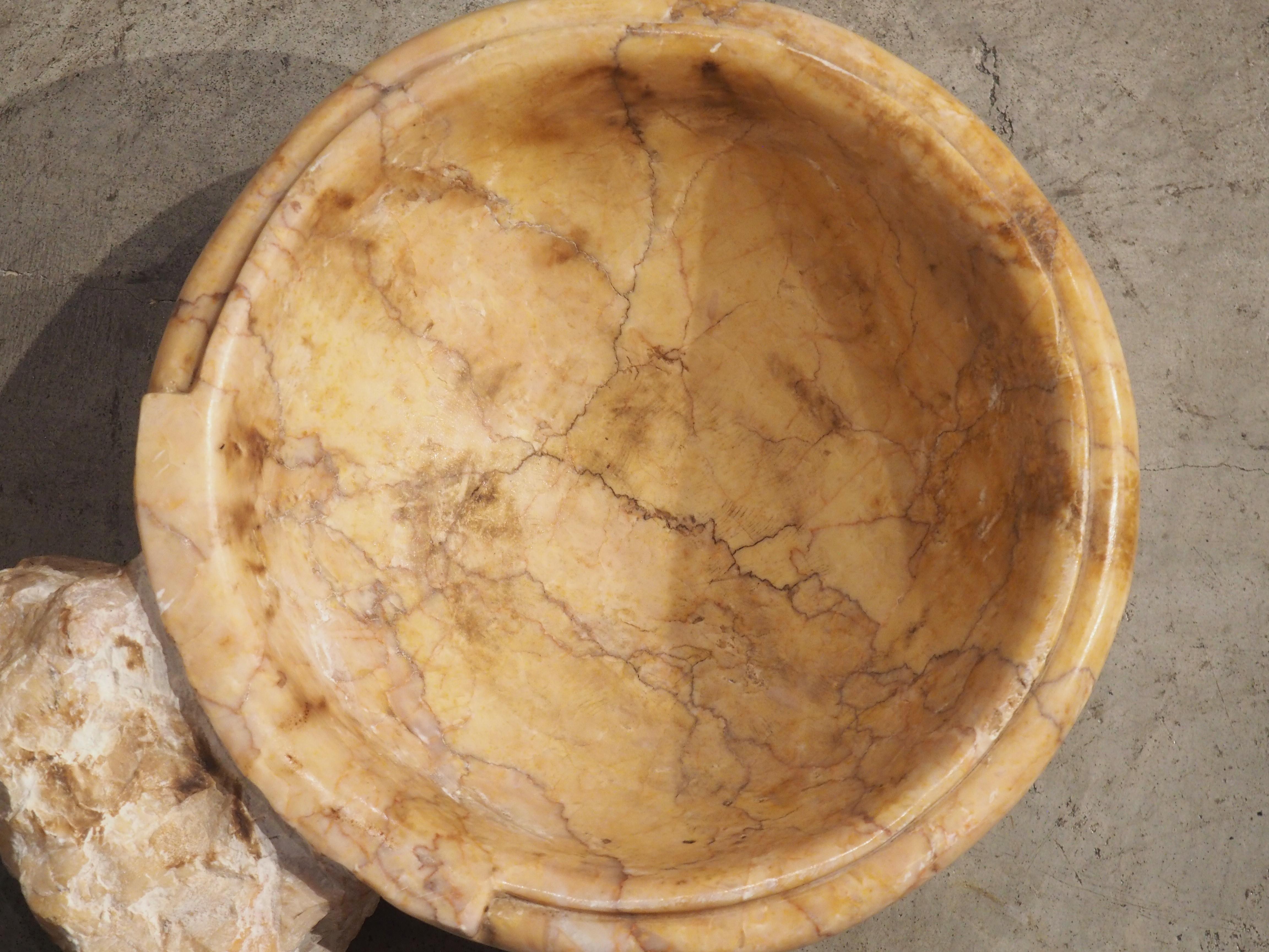 Hand-carved in Italy during, this circular lobed marble font basin would make a great vide-poche. A vide-poche (literally “empty pocket”) is a small storage bowl for everyday items, such as car keys, loose change, wallets, etc.

A marble basin of