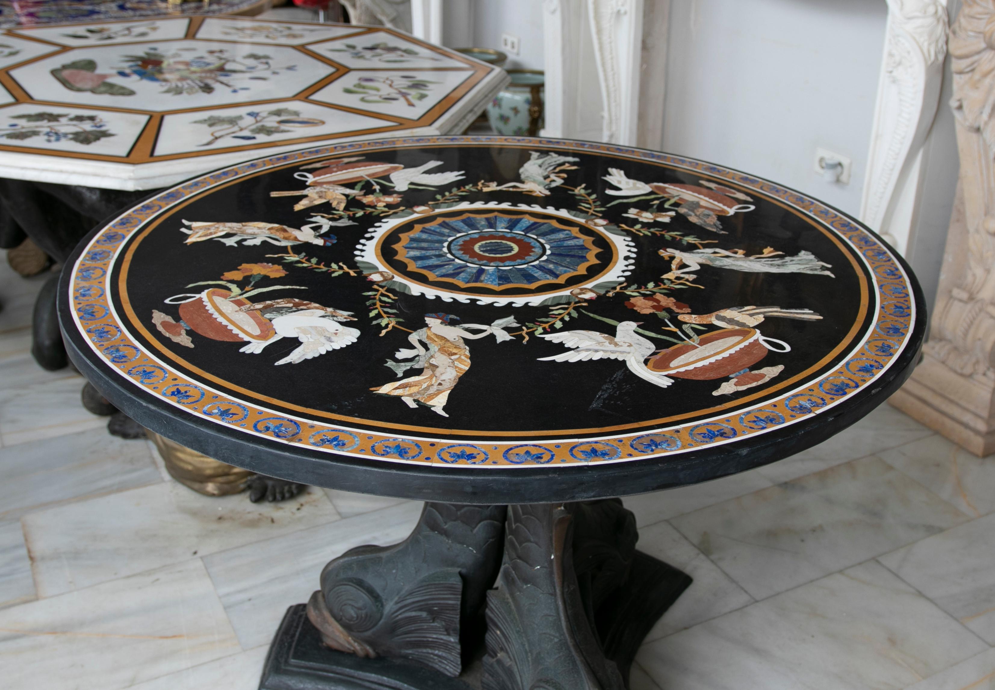 Circular marble table inlaid with hard stones of Greek Scenes.