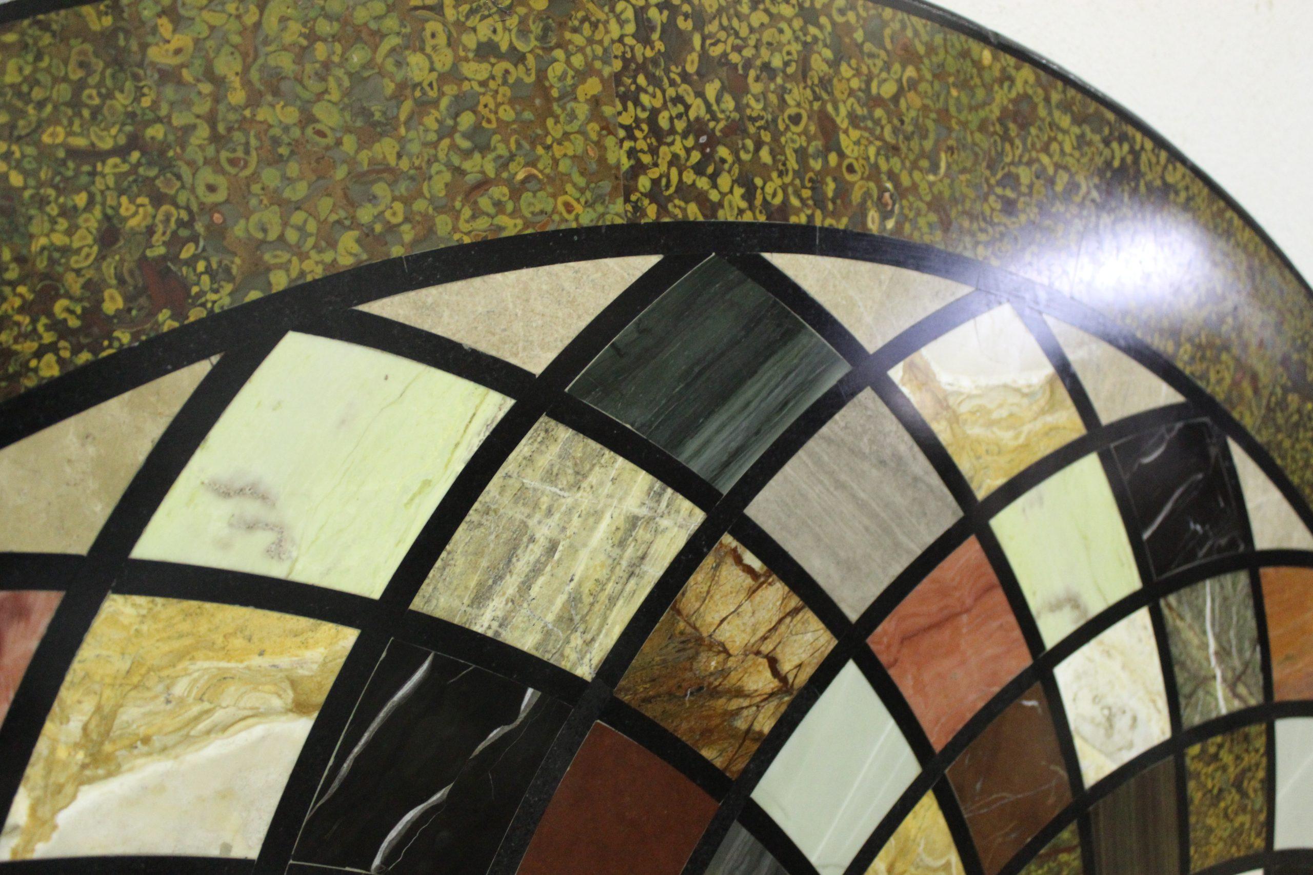 Description:
Round-shaped marble top, inlaid with geometric designs in ancient precious marbles and rare semiprecious stones such as malachite, lapis lazuli, mother of pearl, etc. 
Tags: Piano in marmo di forma circolare. Tapa circular de mármol.