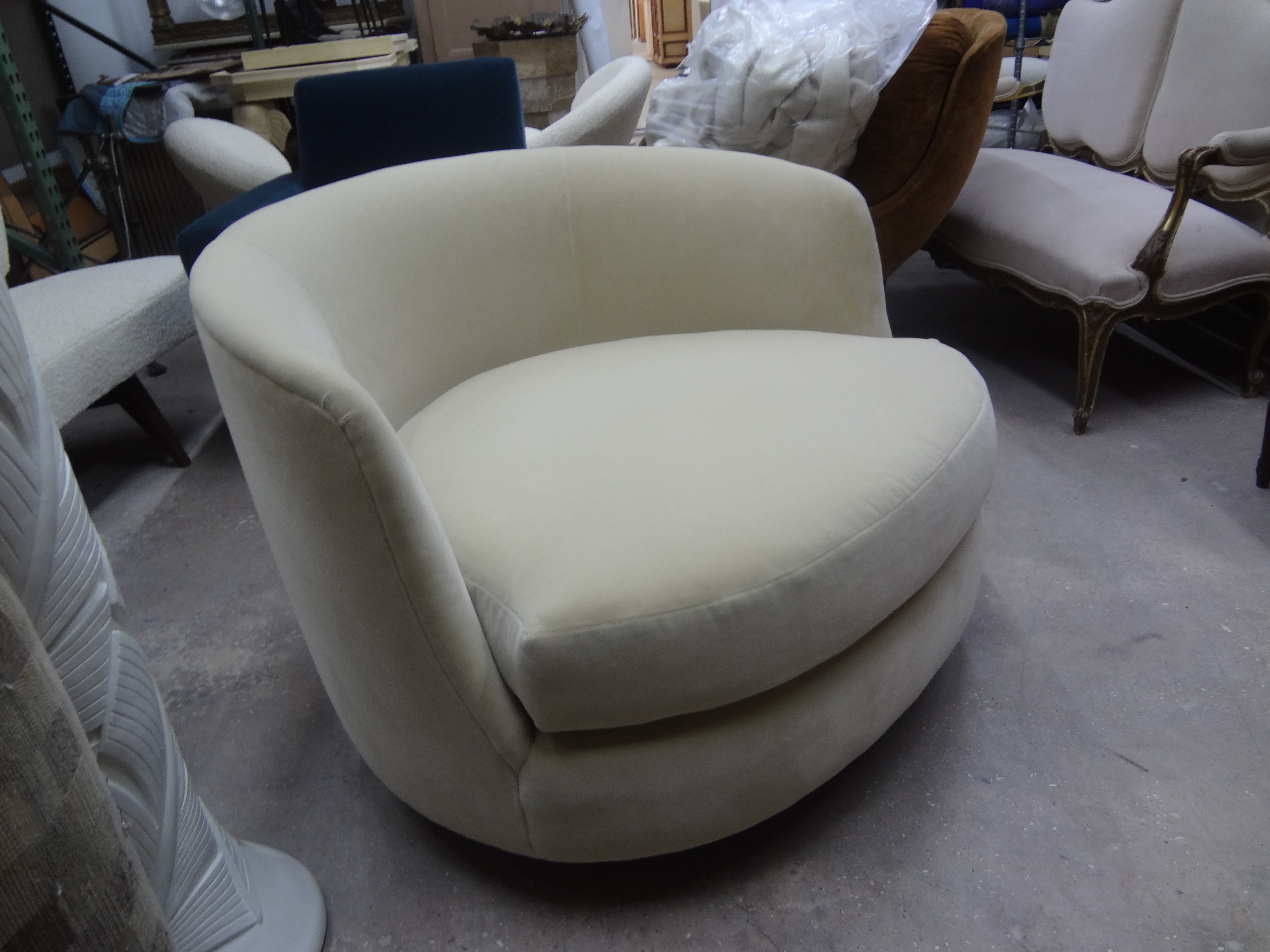 Circular Milo Baughman for Thayer Coggin swivel lounge chair. This Gorgeous Milo Baughman oversized circular swivel lounge chair has been newly upholstered in a cream colored short pile mohair type fabric. Comfortable and stunning from every angle!