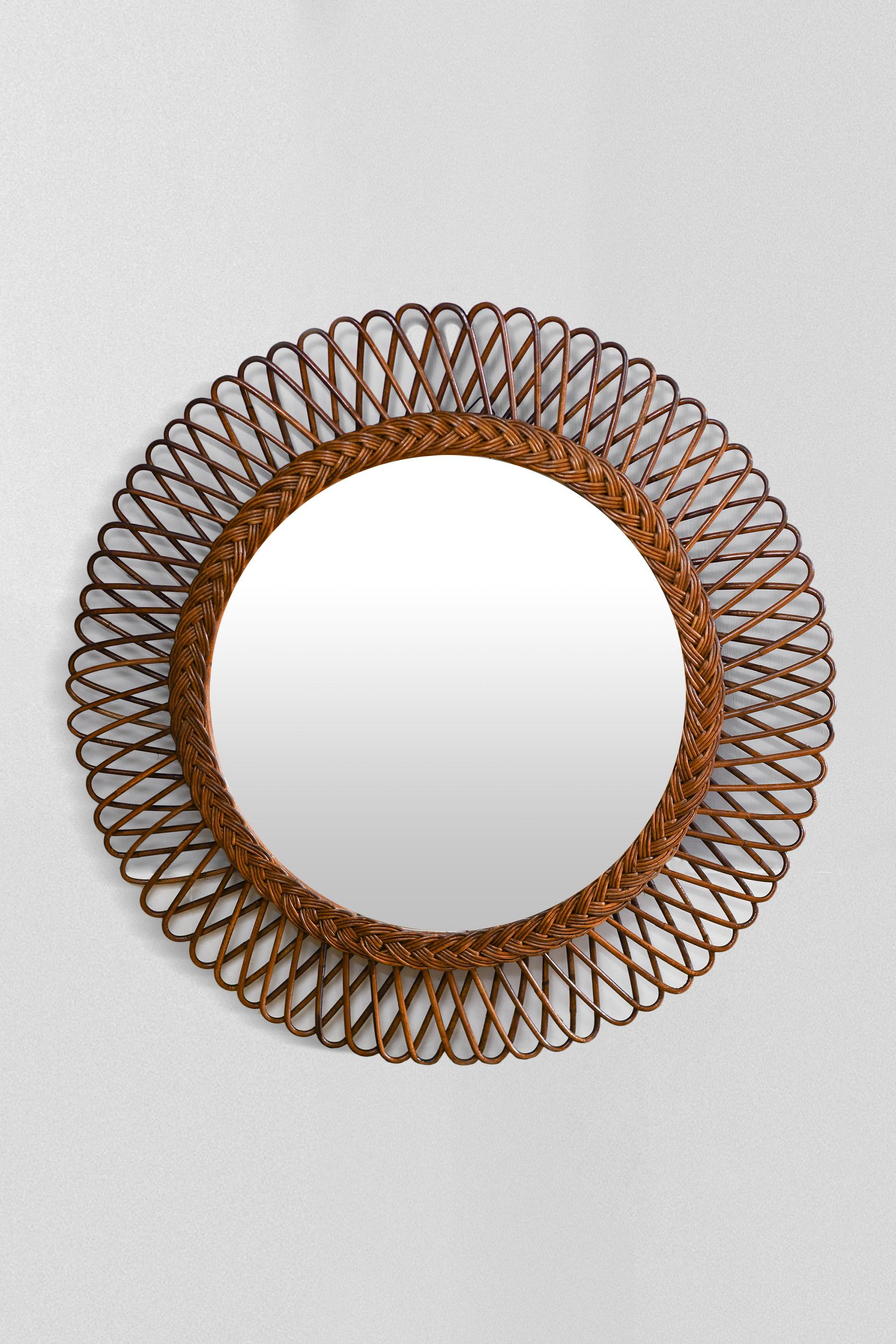 Circular mirror in hand-woven rush, Italy 1970.
Product details
Dimensions: 70 W x 70 H x 4 D cm
