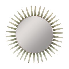 Circular mirror with green glass petal form surround.