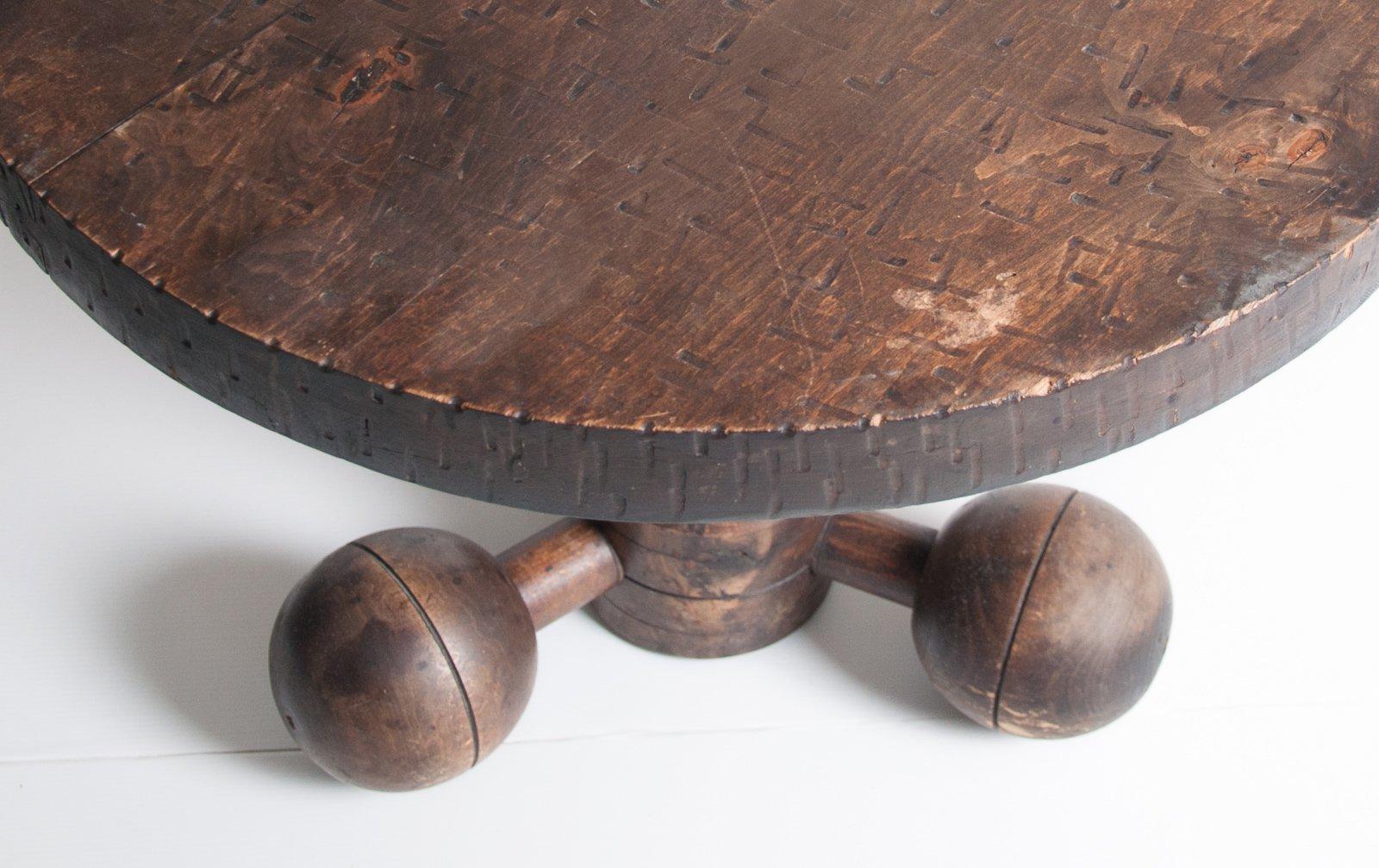Circular Africanist table in walnut by Charles Dudouyt with threaded support and turned ball feet France, 1940s