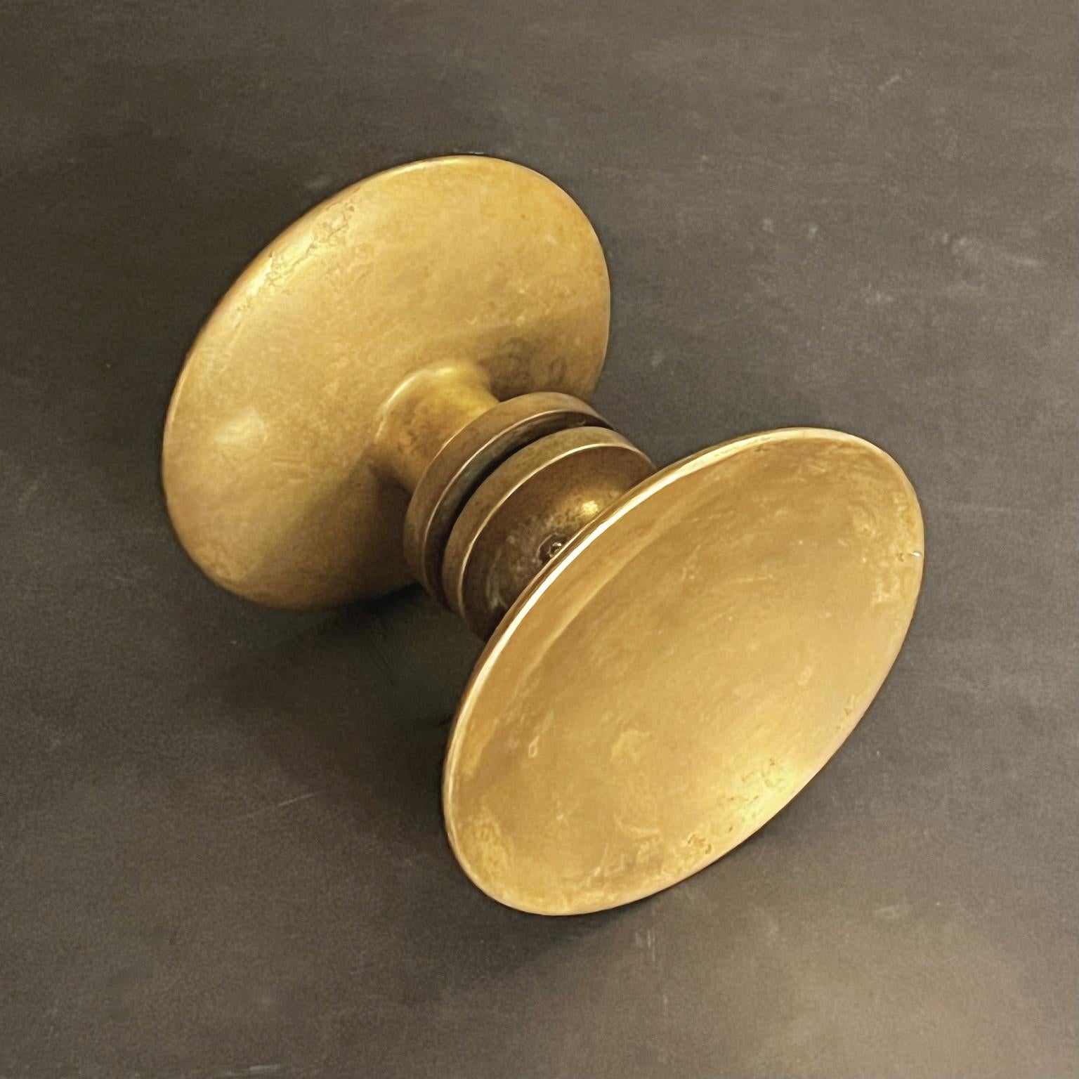 ON HOLD

Circular push-pull door handle in bronze, mid-20th century, France.

A simple elegant handle, made up of two separate round pieces; each side with a slightly concave dish and wide stem. The components are in good vintage condition with lots