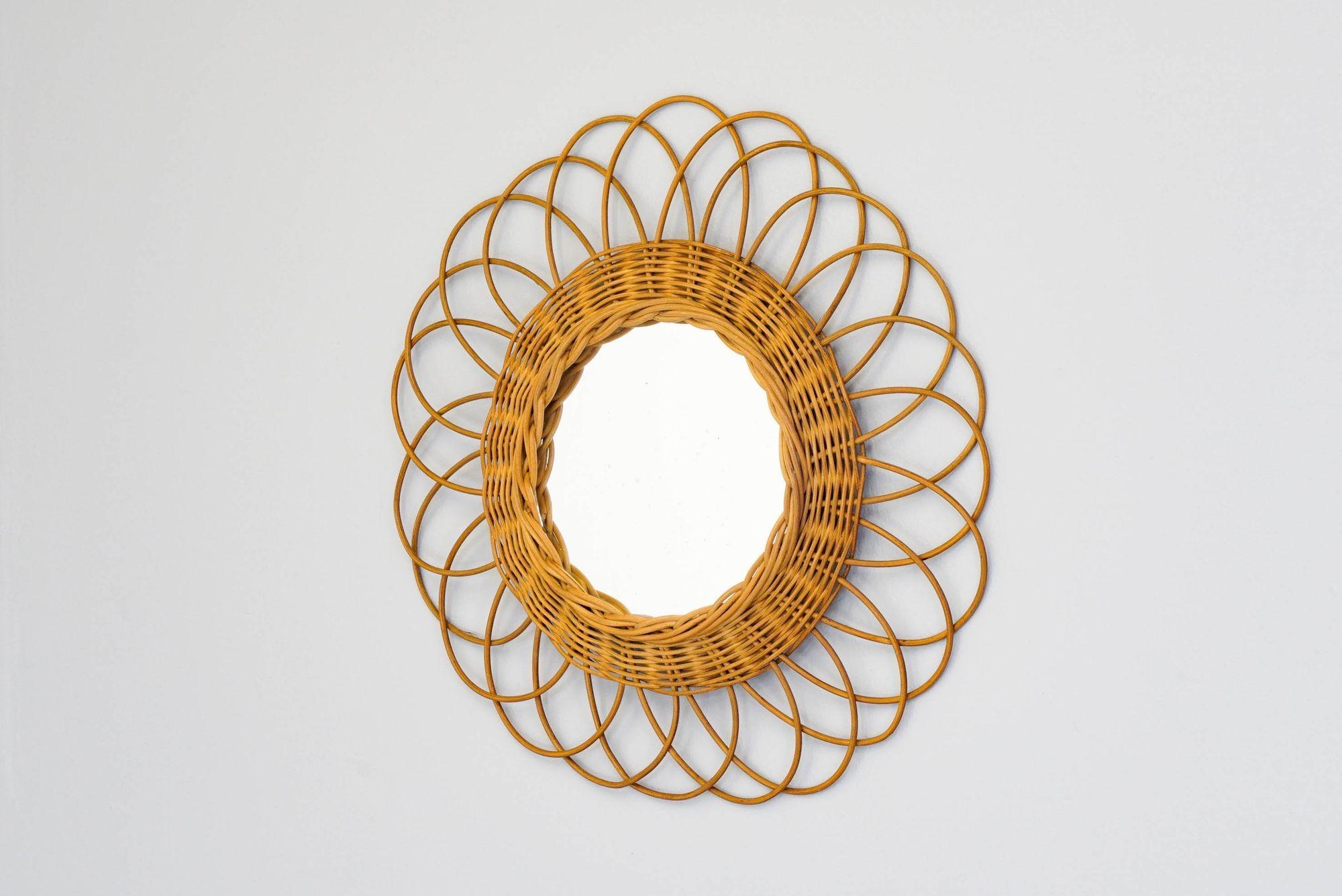 Circular rattan mirror.