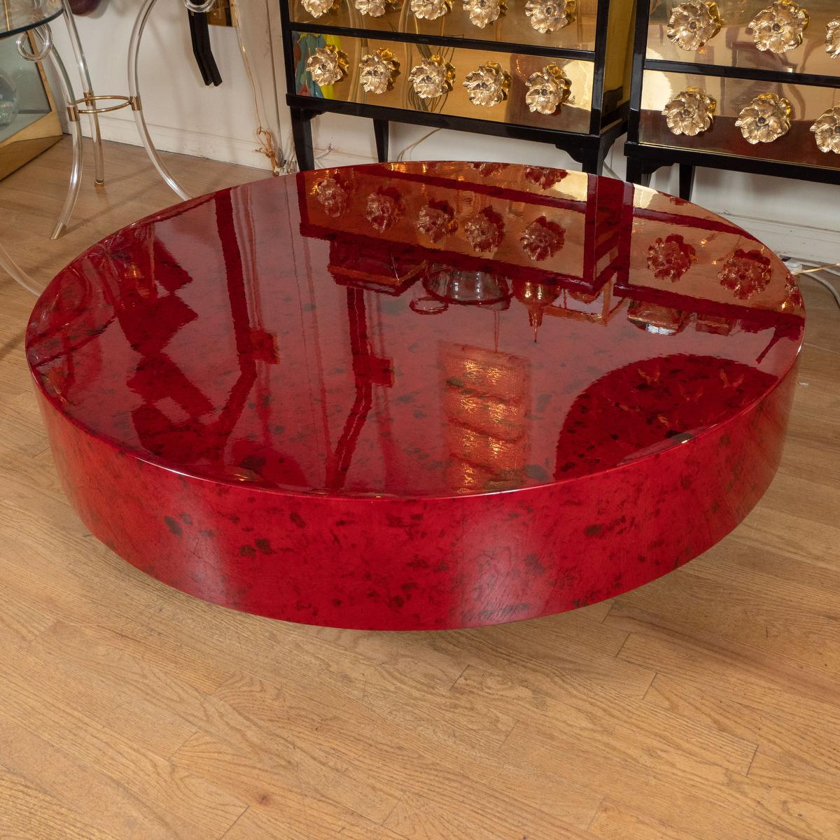Circular red lacquered goatskin coffee table attributed to Aldo Tura.