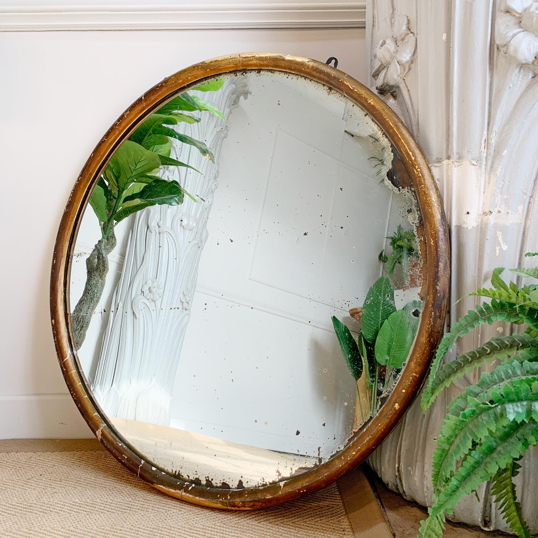 A stunning and very rare gilt gesso over wood circular tailors mirror, with superb foxed mercury plate, dating to the early 19th century. We have had a number of rectangular and square tailors mirrors, but the circular ones of this period are very