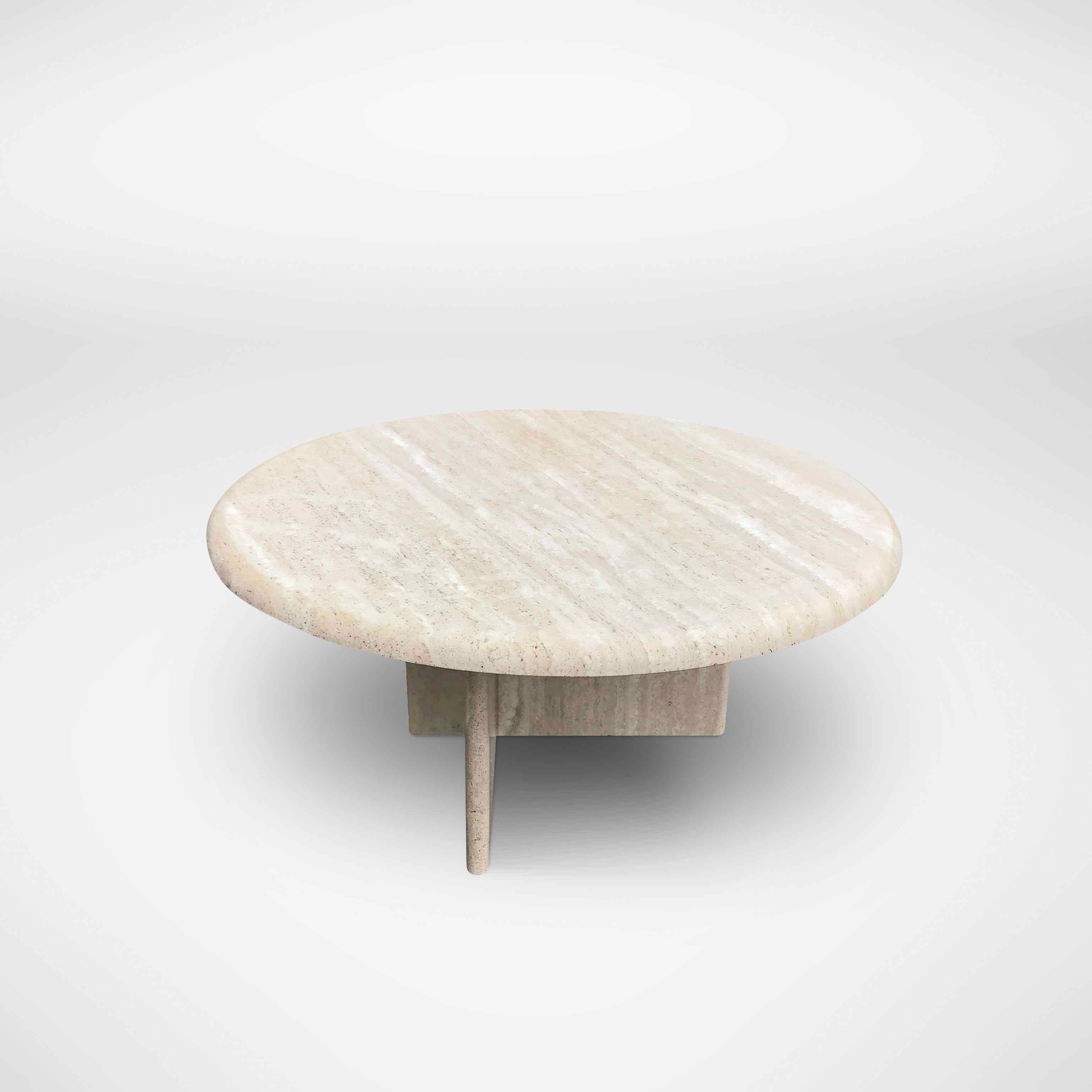 Vintage coffee table in beige colored travertine with a round table top. The base consists of a cross shape and can be placed according to your own taste. 

Italy, 1970s

Designer/Manufacturer: Unknown

In very good condition, only minor