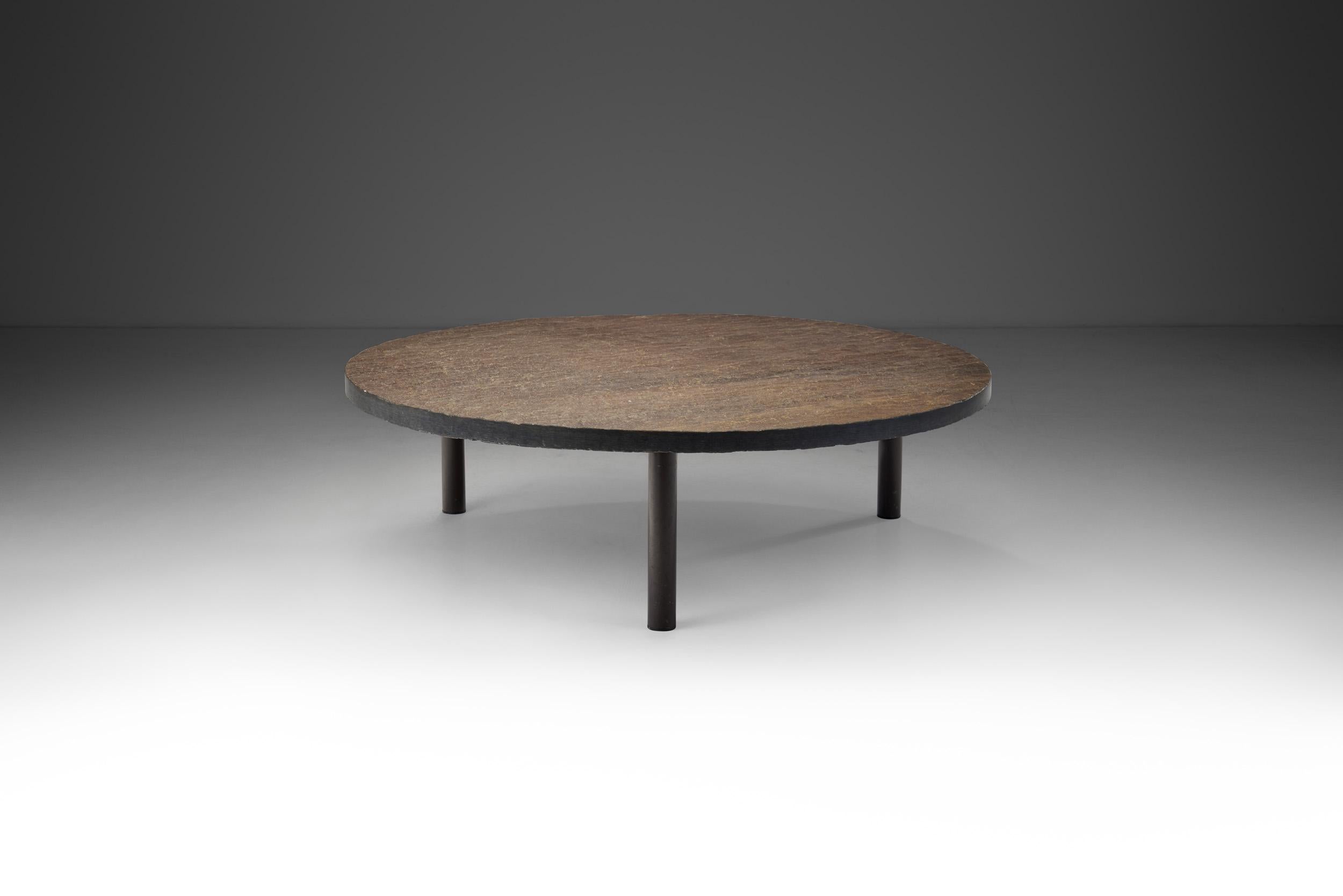 This solid stone top coffee table is a perfect example of the European mid-century design emphasis on the connection of everyday objects to nature, and the visual benefits of an understated, organic design.

This coffee table follows the
