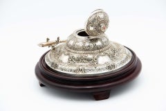 Circular silver and wooden inkwell