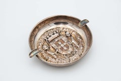 Circular silver ashtray with two cigarette holders