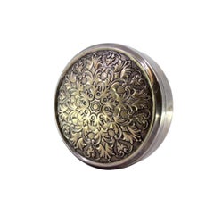Circular silver box with floral reliefs on the removable lid