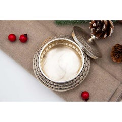 Circular silver box with symmetrical reliefs and removable lid