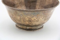 Circular silver candy box with floral motifs