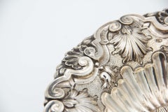 Circular silver fruit bowl centerpiece