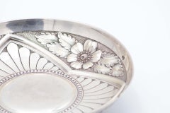 Circular silver fruit bowl