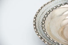 Circular silver fruit bowl