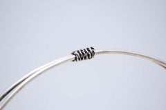 Circular silver fruit bowl with double fixed handle