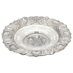 Circular silver fruit bowl with scalloping