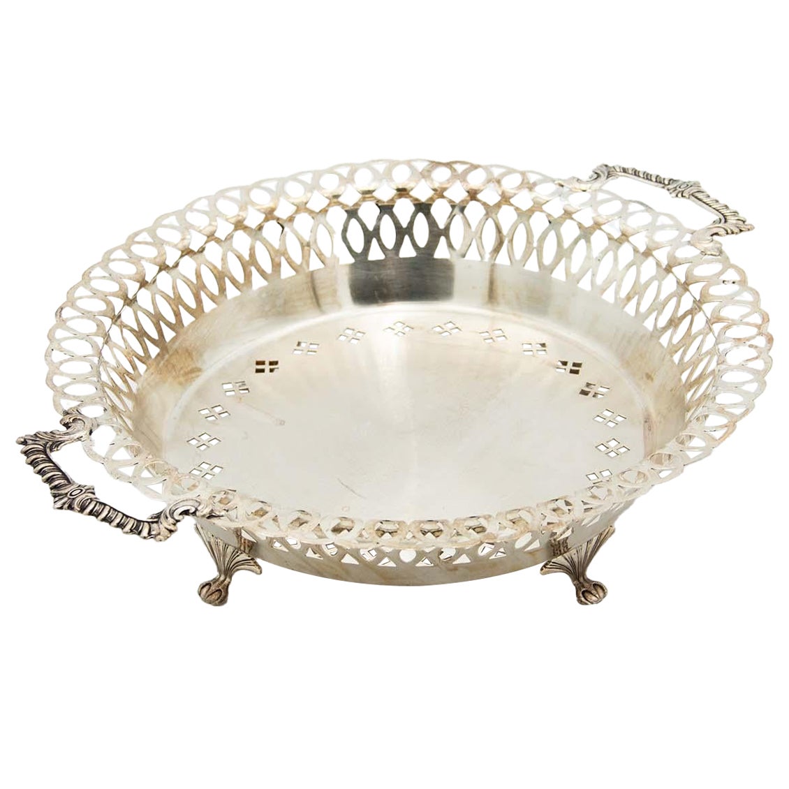 Circular silver fruit bowl with wire rack