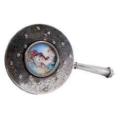 Circular silver hand mirror