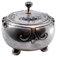 Circular silver jewelry box with four support feet Circular silver jewelry box with four support feet