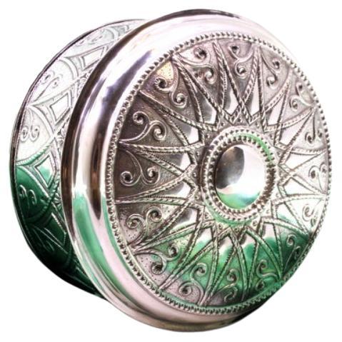 Circular silver tea box with pearly frieze and monogram