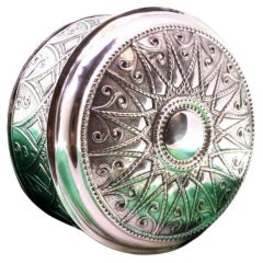 Circular silver tea box with pearly frieze and monogram