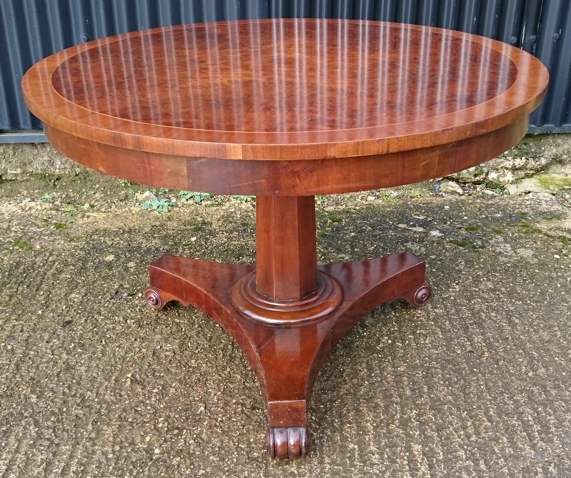 Early 19th century breakfast table base, the top replaced with a very fine bookmatched burr walnut surrounded with satin wood stringing and mahogany crossbanding. This is a very elegant table with slender base, good knee clearance and a