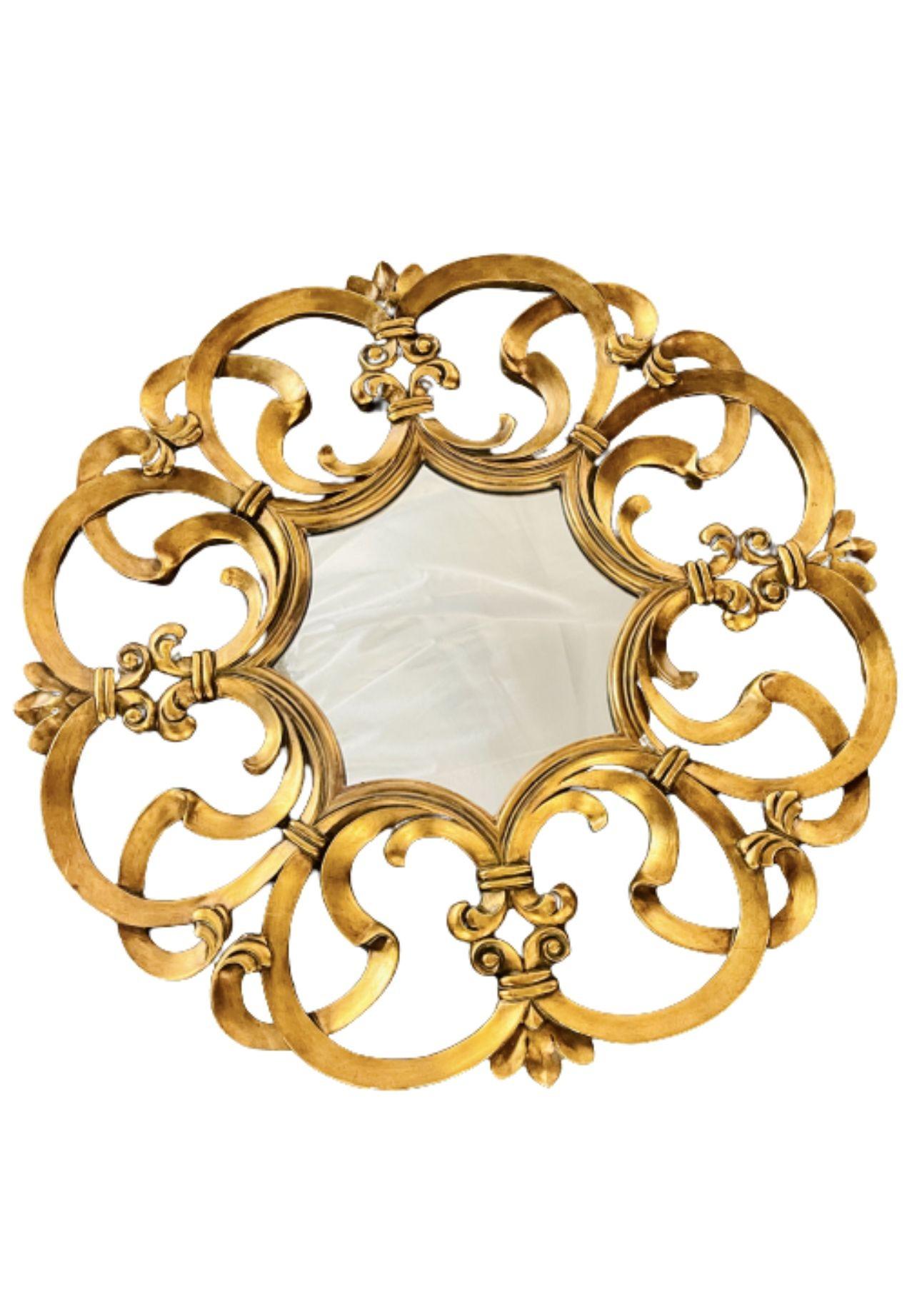 Circular wall, console or Pier mirror, Italian, gilt wood.
 
 
The whole having a pierced gilt gold fame of circluar design with a center mirror. The frame carved in the form of a kings crest.
