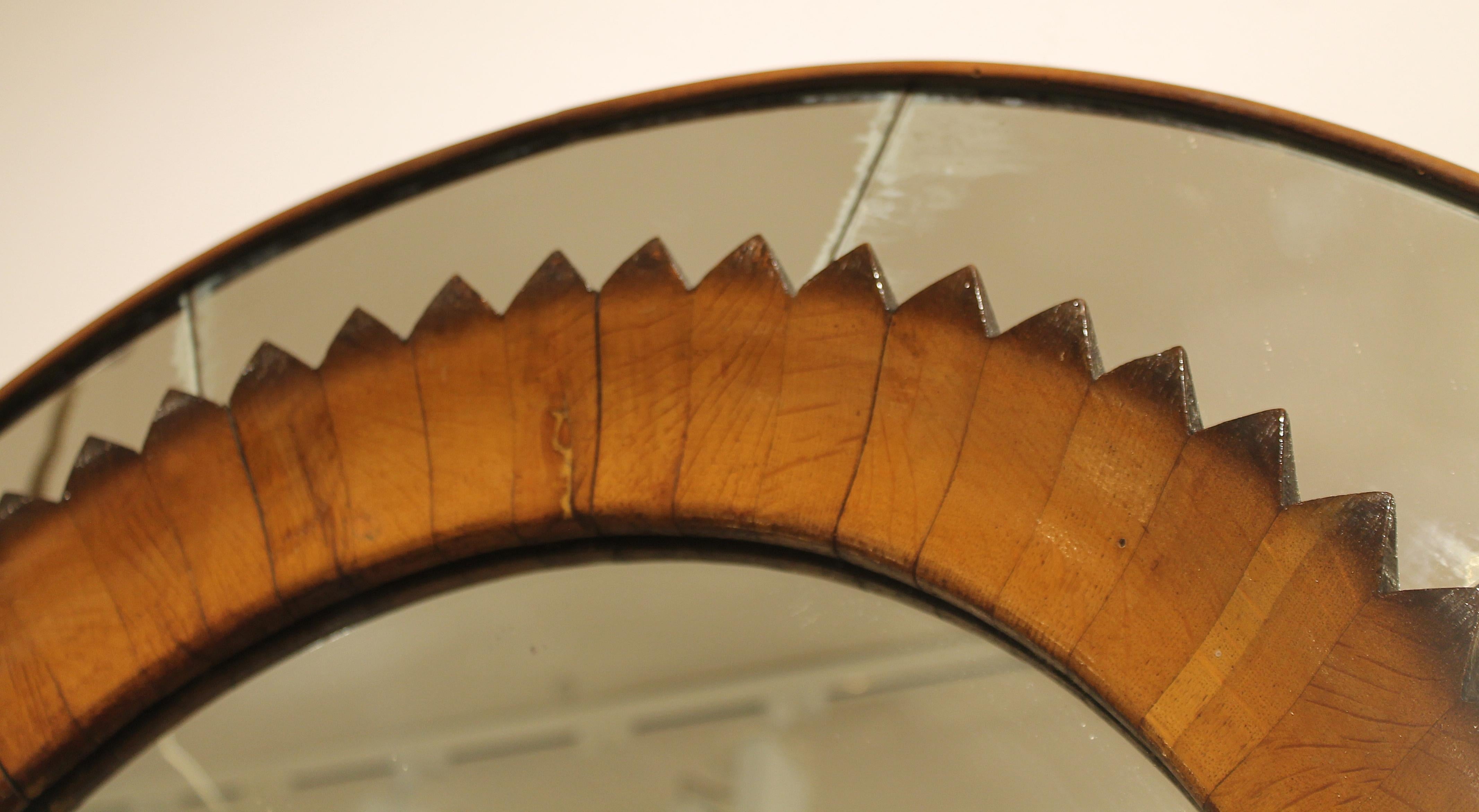 Circular walnut wall mirror by Fratelli Marelli, Italy, circa 1950s.