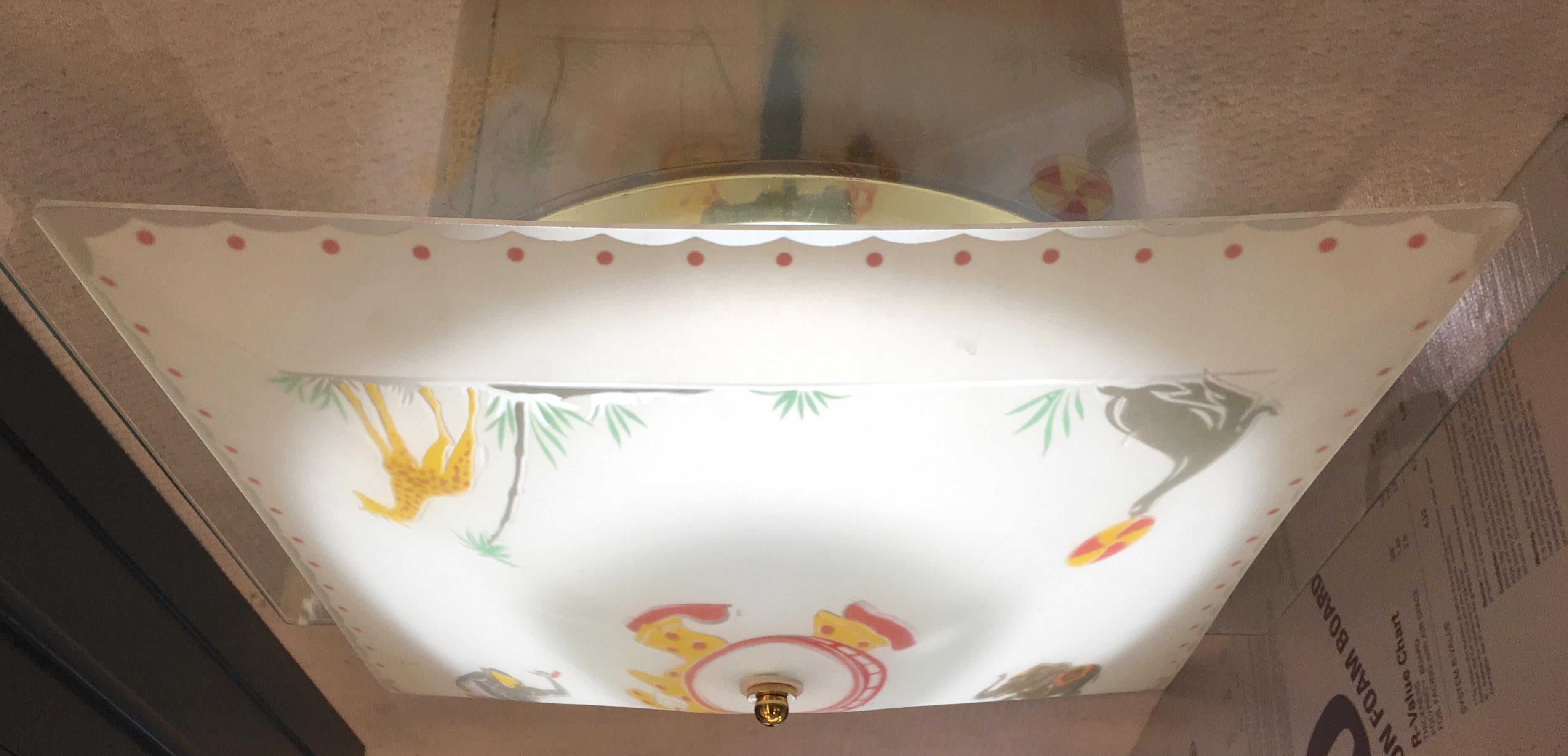 Simple yet chic square glass flush mount ceiling light consisting of a square moulded glass reflector in white satin finished and enameled with whimsical animal characters which show striking resemblance to the Hermes 