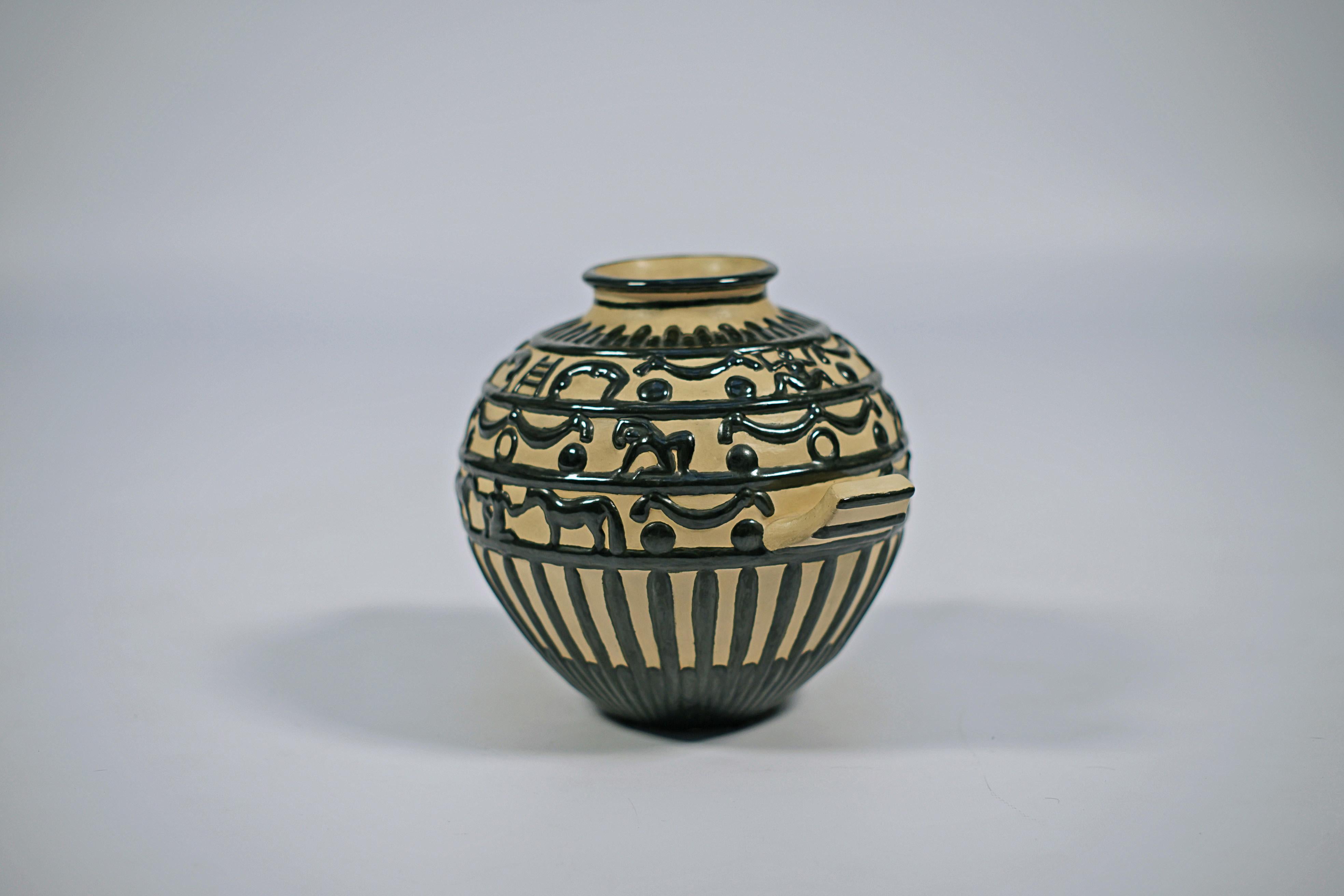 Ceramic vase by Gio Ponti (1891-1979). Two-Handled vase decorated in relief with circus theme.

Valerio Terraroli (2007) 