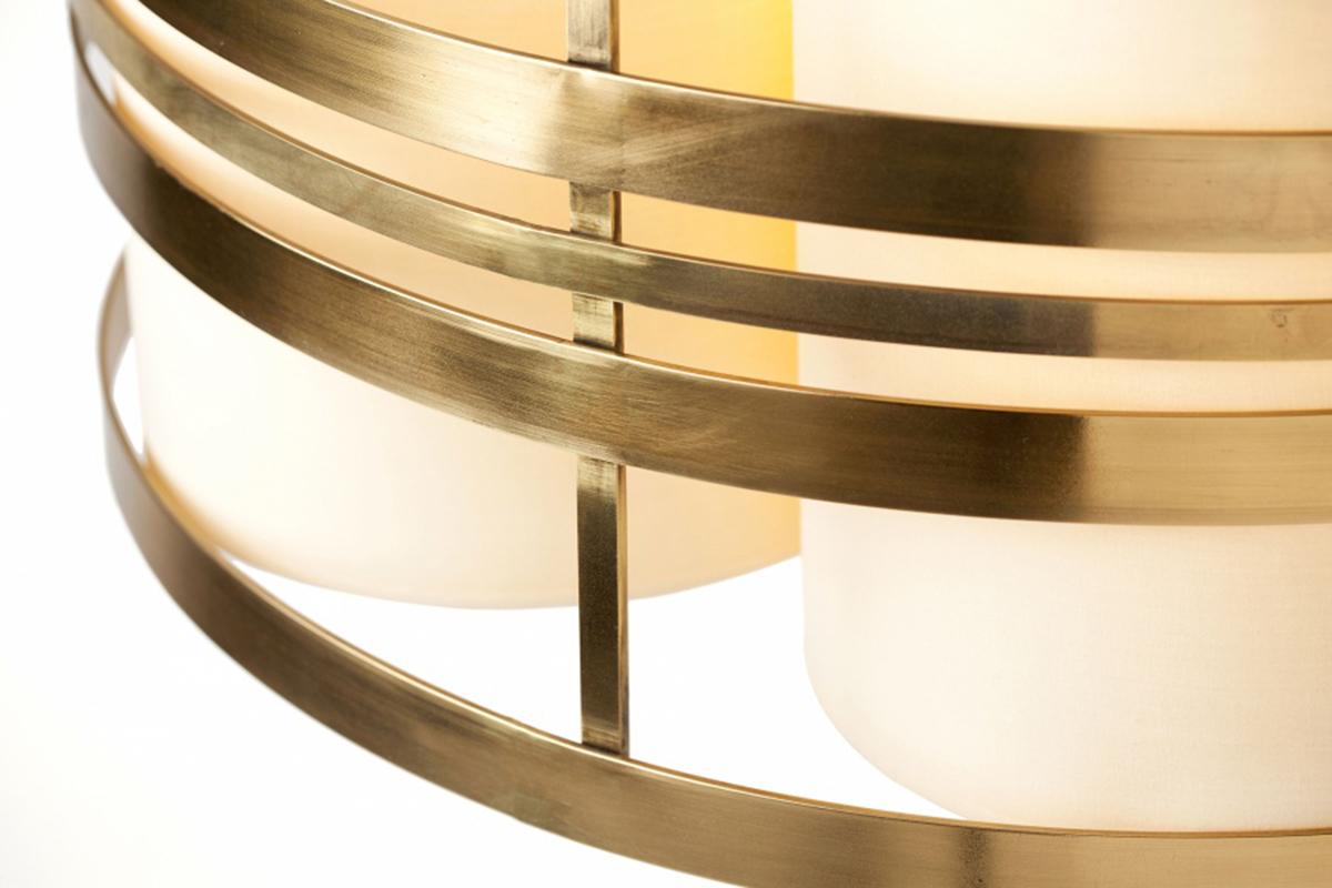 With a shimmering round and clear design, the Circus Pendant lamp brings a unique and alluring style any space. A poetic, round shape that expresses a feeling of light weight and motion, made of polished brass and translucent cotton shades. Made to