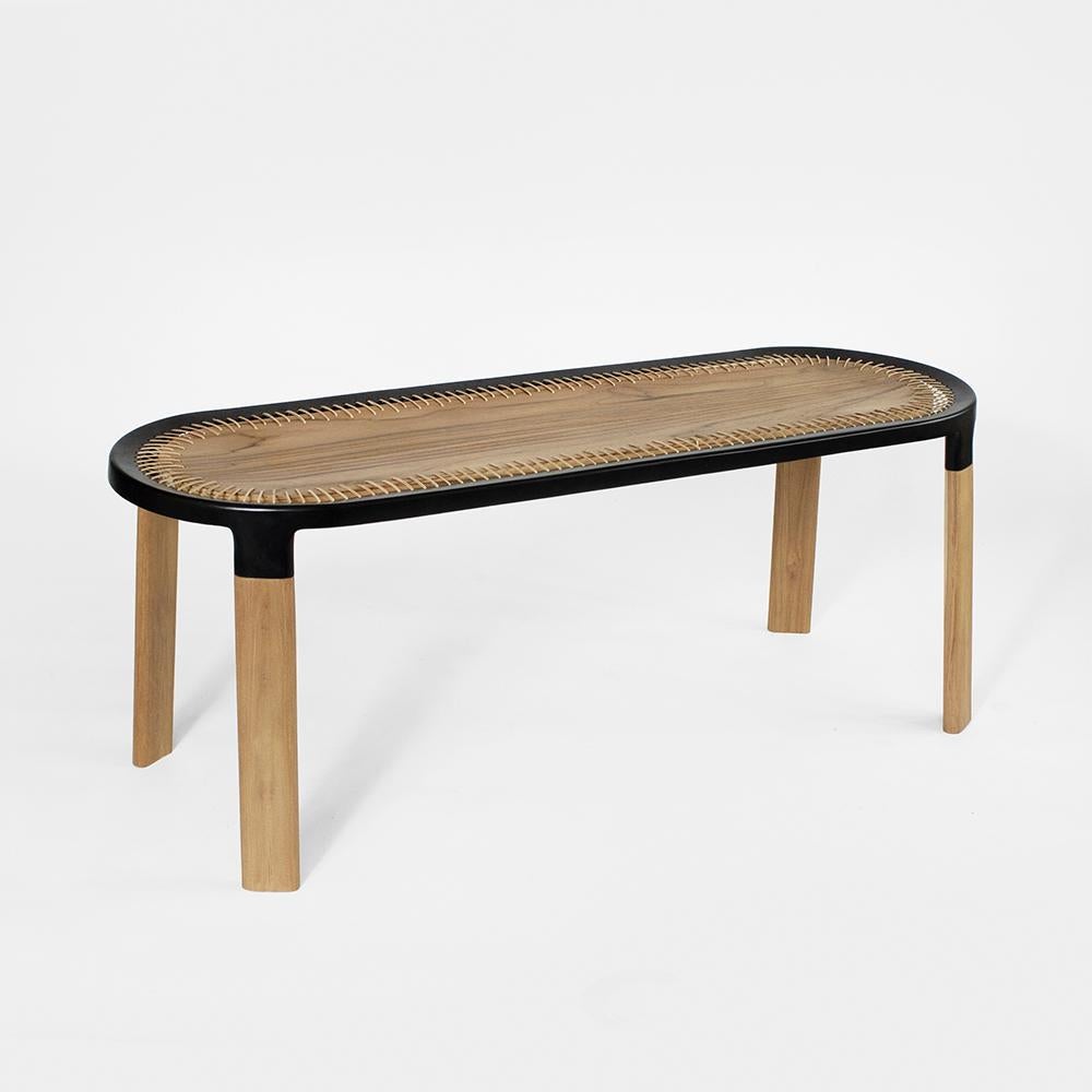 Banc Ciro de Murubi
Dimensions : L 120 x P 50 x H 45,5 cm : L 120 x D 50 x H 45,5 cm. 
MATERIAL : Bois de teck - Nature ; fonte d'aluminium - revêtement en poudre noir ; canne - naturelle. 

Murubi est une marque de design contemporain basée en