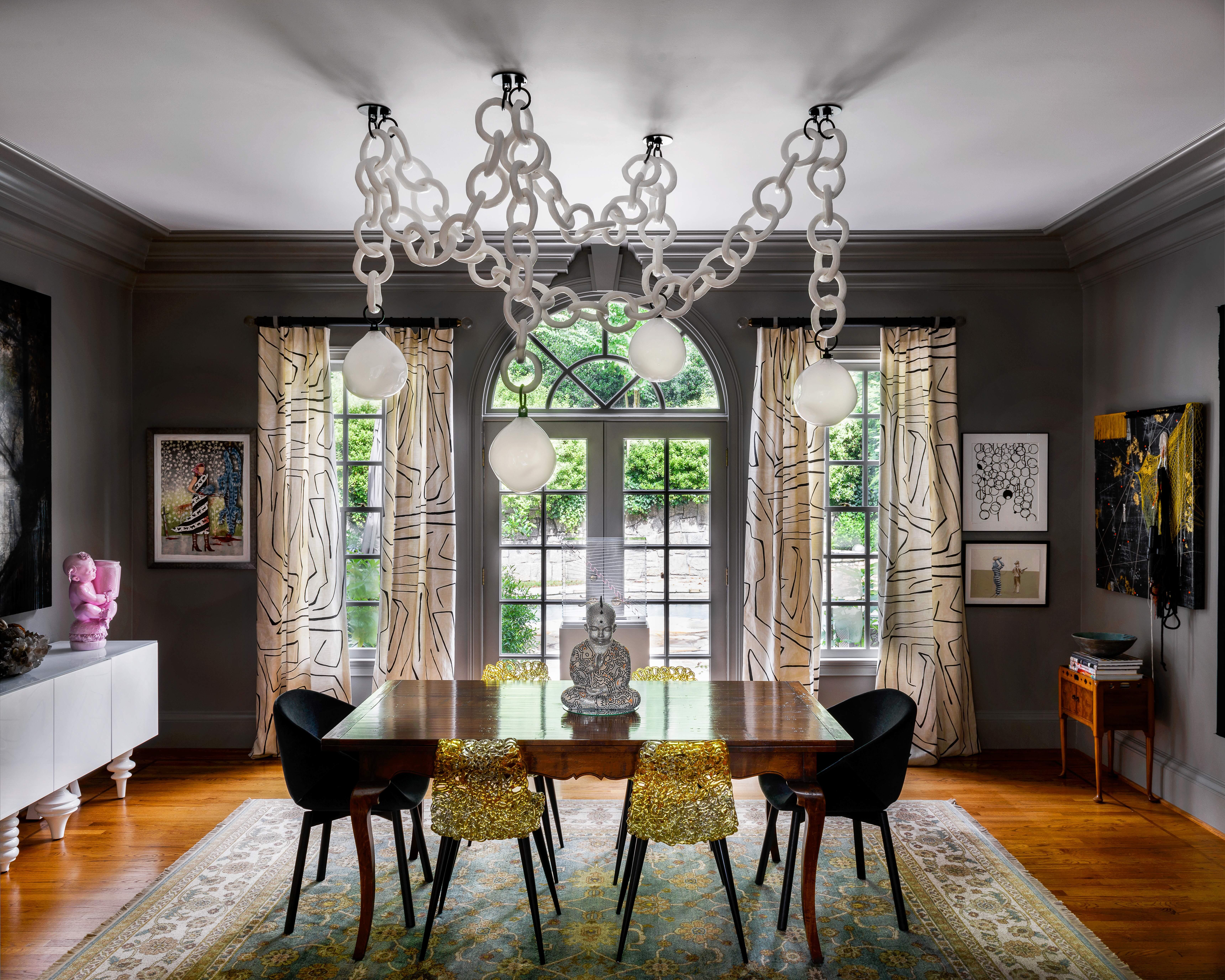 Sculptural, bold, and unmistakably modern, the Cirque 4 Drop Swagged Chandelier transforms any space into a statement. Handcrafted in our Georgia, USA studio, this artful fixture begins with a solid wood and metal base, sculpted by hand using a