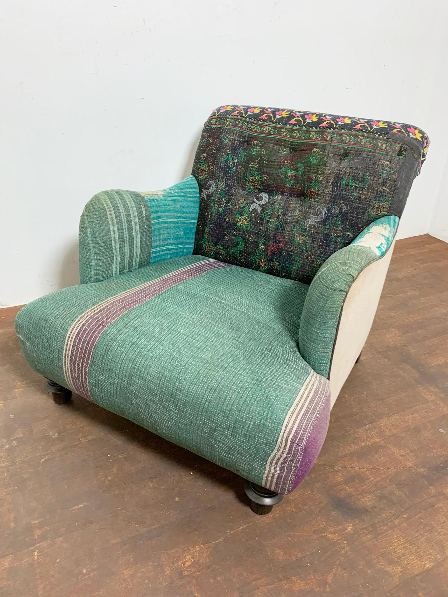 A one-of-a-kind Acacia chair by Cisco Brothers, upholstered in antique Bengali kantha quilts.
