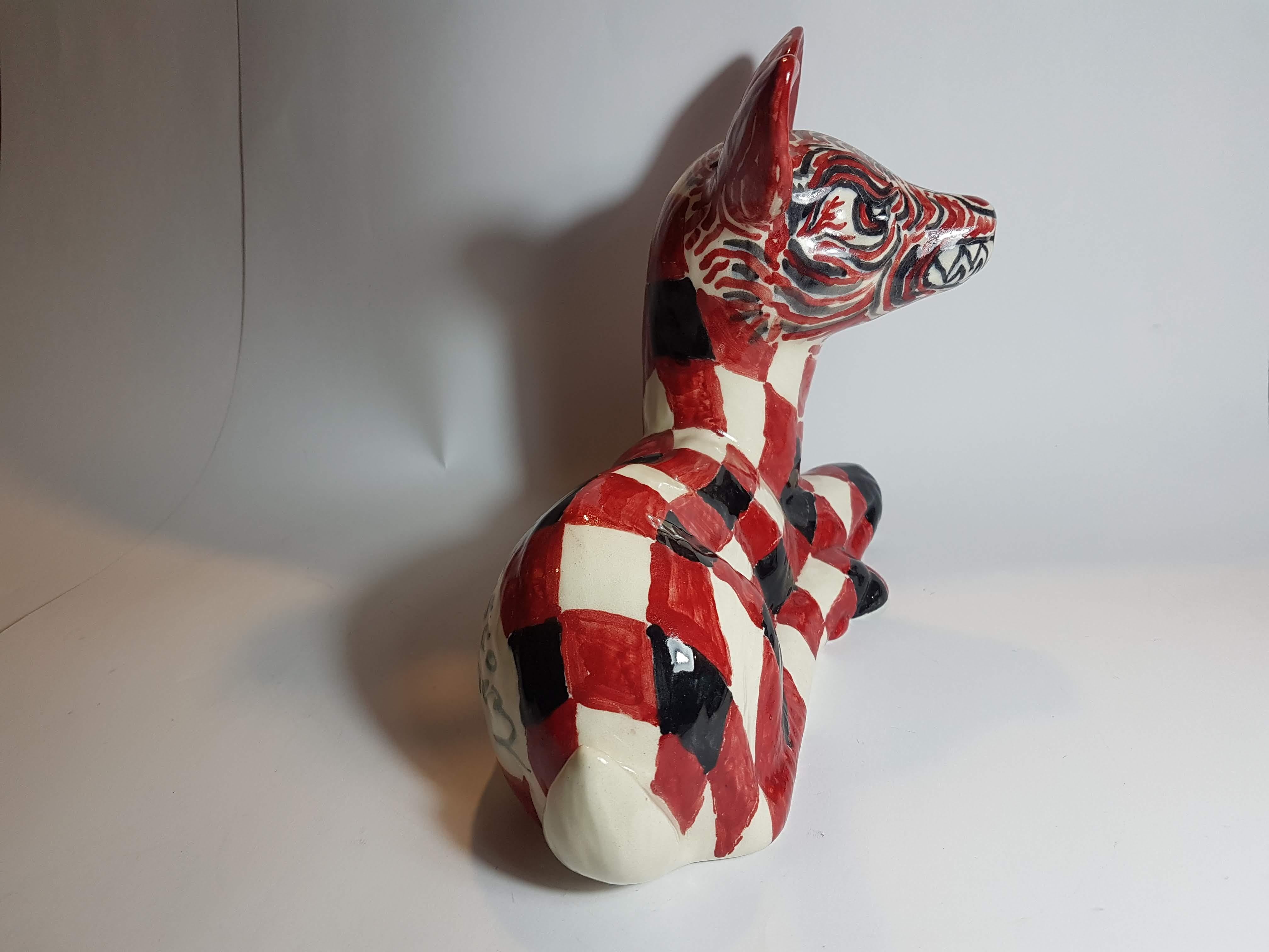 A striking ceramic deer with demonic face and checkered body. Hand painted by Mexican artist Cisco Jiménez. Signed and dated 2011.

Born in Cuernavaca, México in 1969, Cisco Jiménez is a multidisciplinary artist whose body of work includes painting,