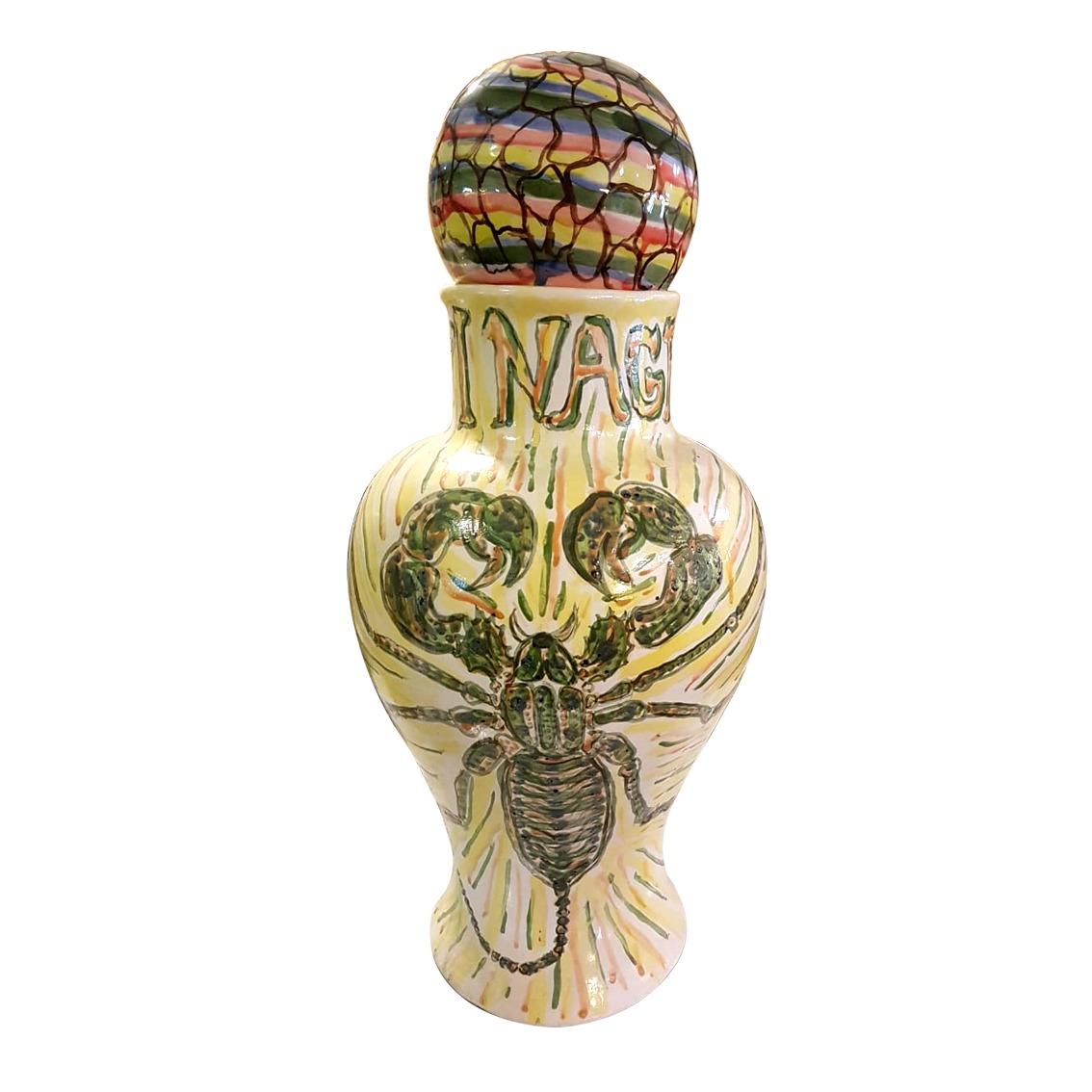 A rare Cisco Jiménez hand painted ceramic jar depicting a whip scorpion with a sphere on top. Signed and dated 2011.

Born in Cuernavaca, México in 1969, Cisco Jiménez is a multidisciplinary artist whose body of work includes painting, sculpture,