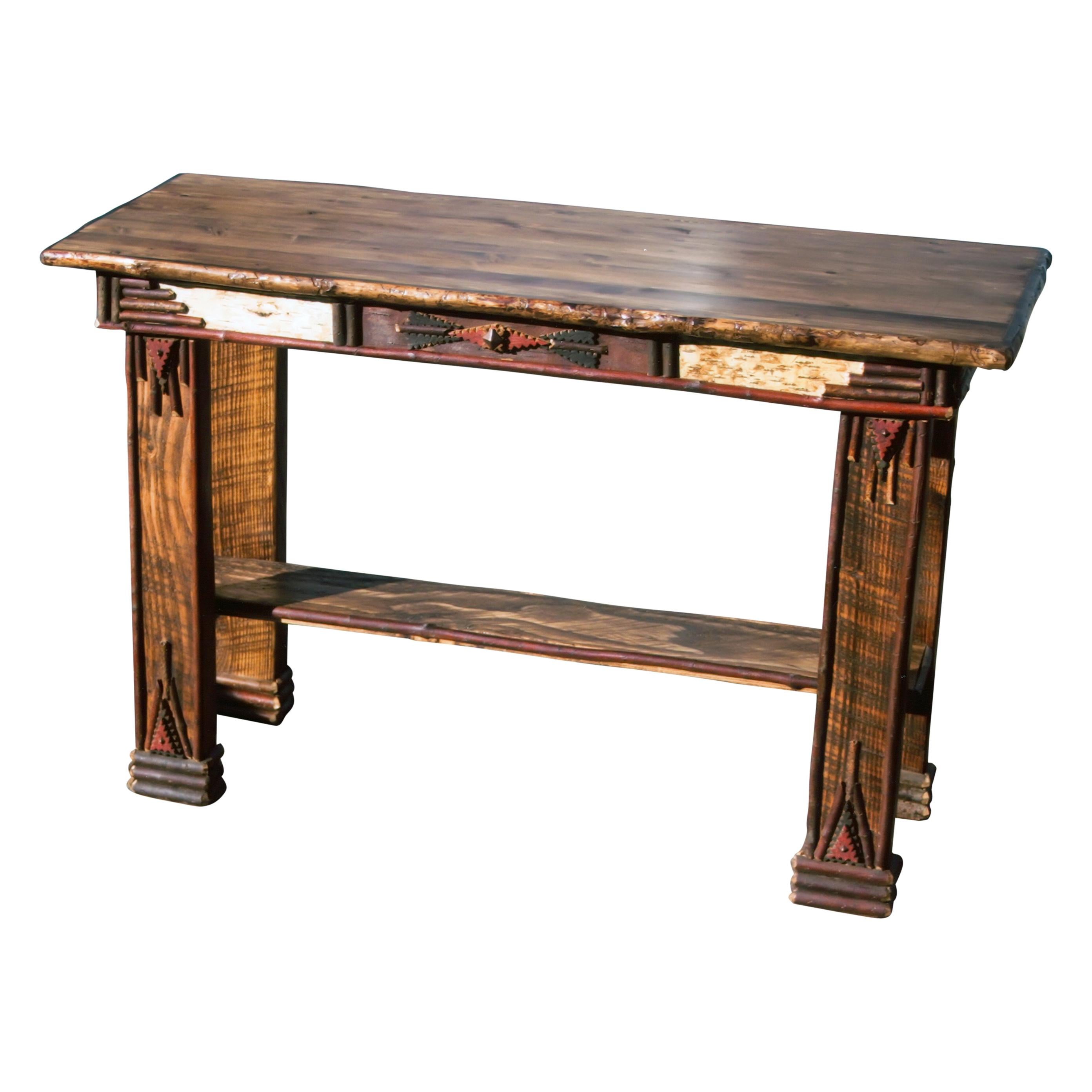 Tramp art style hall table. With lodge pole, birch bark, twig-work and hand notching, with bottom shelf. Built to order and can be customized by color, details and dimensions with additional production time. 

Period: Contemporary

Origin: