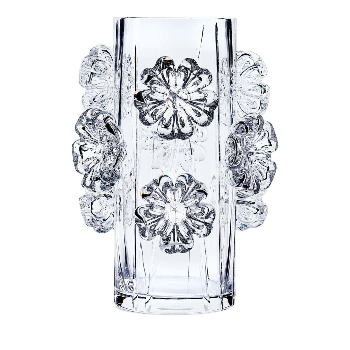 This stunning vase was crafted entirely by hand and is part of the Cistus collection. It was made of crystal with over 24% PbO in a timeless conical shape creased with vertical grooves that create a dynamic texture. The standout element of this