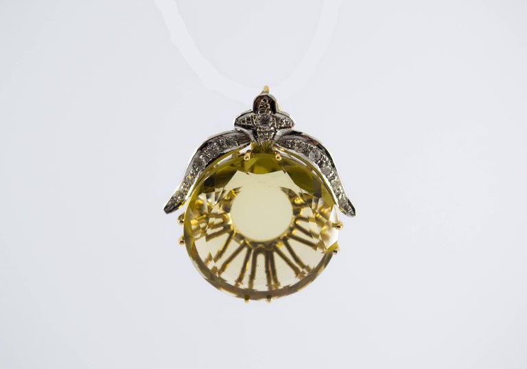 This Pendant is made of 14K Yellow Gold and White Gold.
This Pendant has 0.25 Carats of White Diamonds.
This Pendant has also a big Citrine.
We're a workshop so every piece is handmade, customizable and resizable.